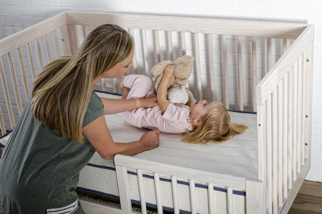 organic crib mattress with mom and baby